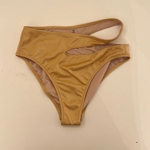 Gold Victoria’s Secret bathing suit bottom.